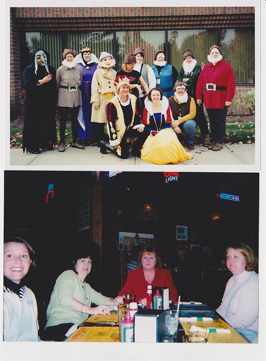 A diverse group in costumes joyfully poses outdoors, showcasing vibrant outfits.