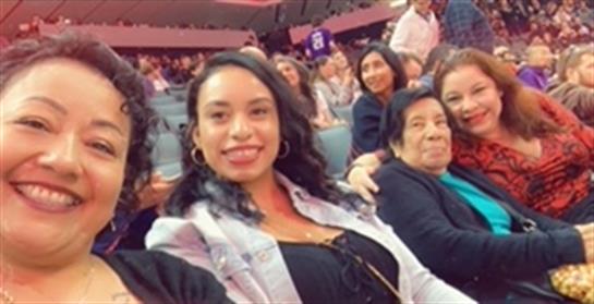 Friends gather in a lively atmosphere, sharing smiles and enjoying their time together.