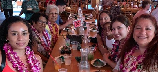 Families gather in a lively restaurant, enjoying meals, laughter, and shared stories.