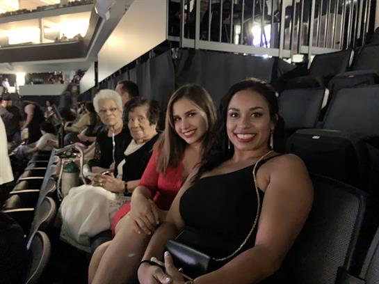 Friends relish a fun night at the stadium, capturing smiles and cheerful moments together.