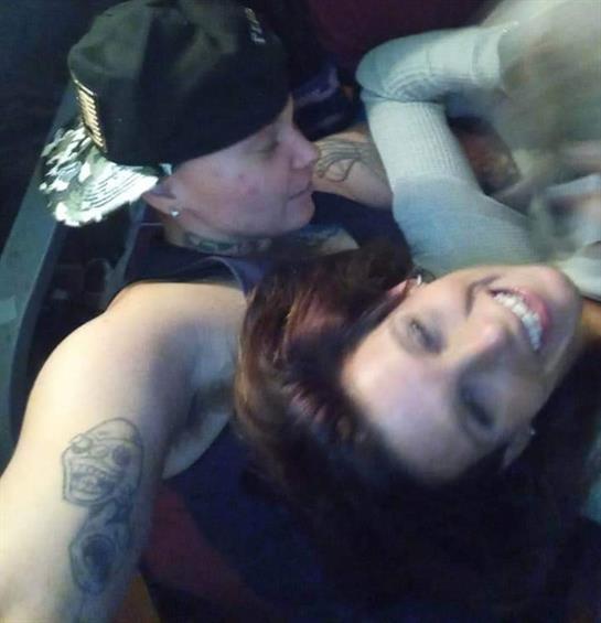 Friends enjoy each other's company, smiling and laughing in a relaxed atmosphere after dark.