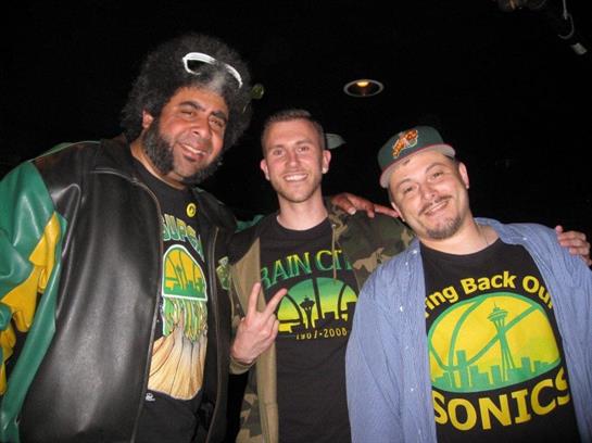 Three friends pose together at a music event, showcasing their energetic spirit and unique fashion.