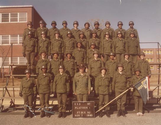Uniformed soldiers stand in formation for a group portrait at training grounds in November.