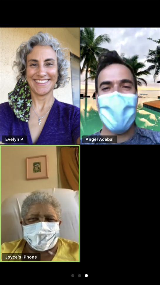 Two friends connect online, smiling and chatting while a tropical setting enhances the mood.