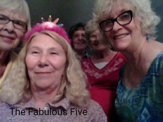 A cheerful gathering of women enjoying each other's company while sharing smiles and laughter.