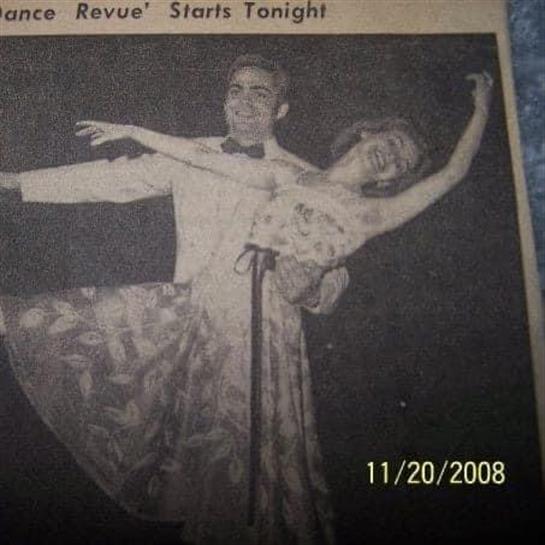 Dancers showcase their talent on stage during an engaging revue performance at night.