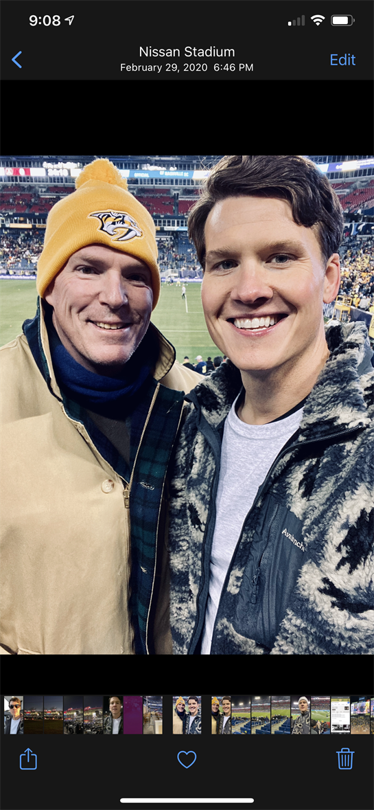 Friends take a selfie at a exciting sports event, showcasing their team spirit and enthusiasm.