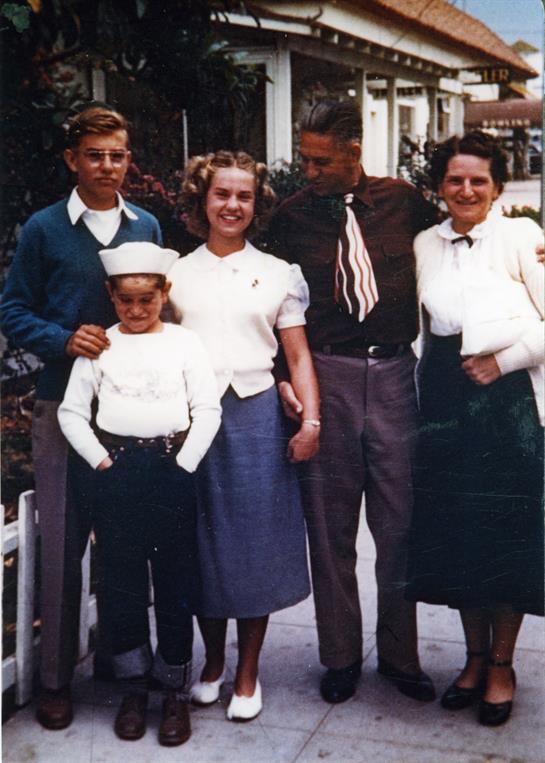 Five people stand together in the neighborhood, showing diverse styles and expressions.