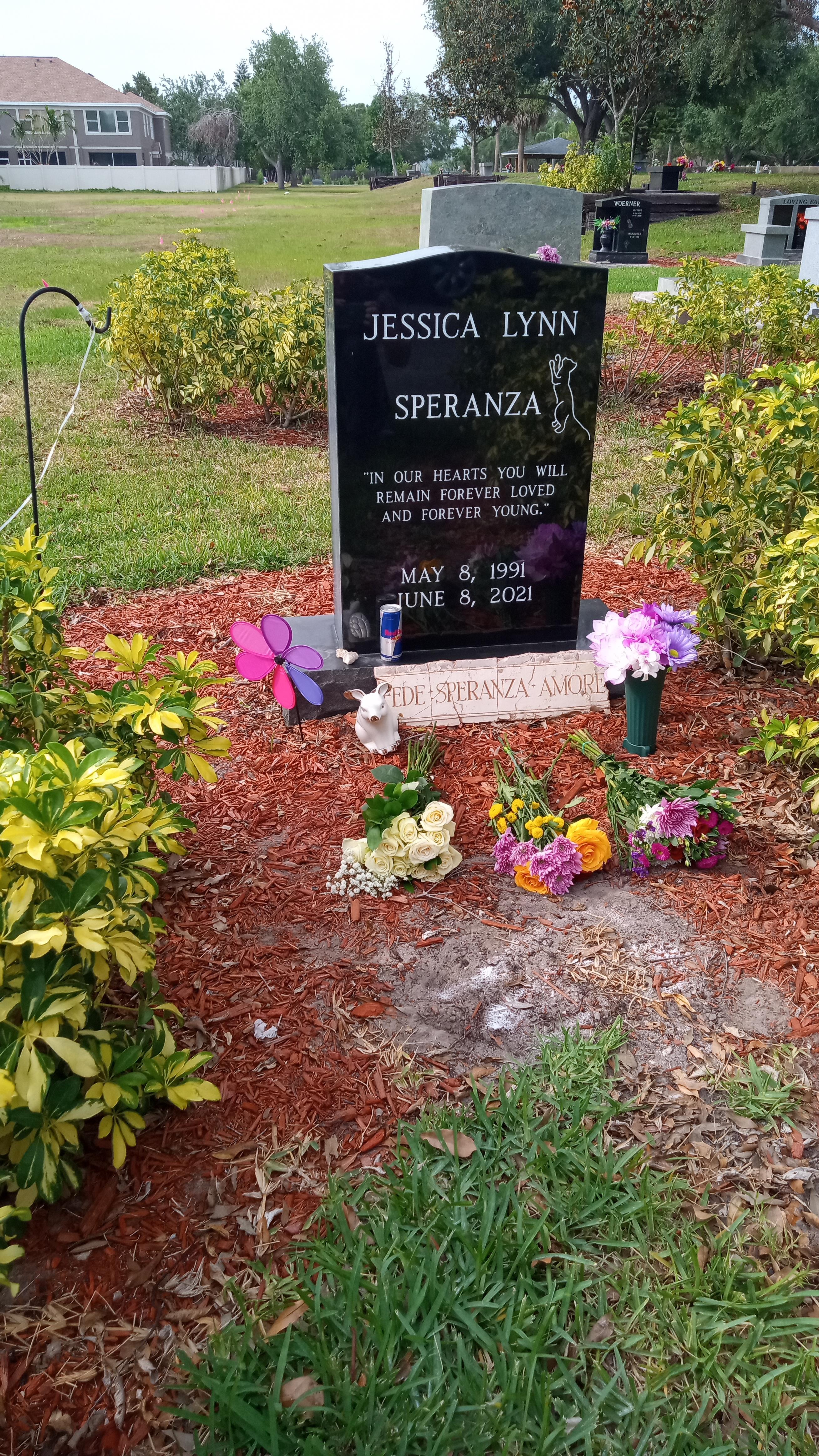 Family and friends honor Jessica Lynn Speranza with flowers and mementos at her grave site.