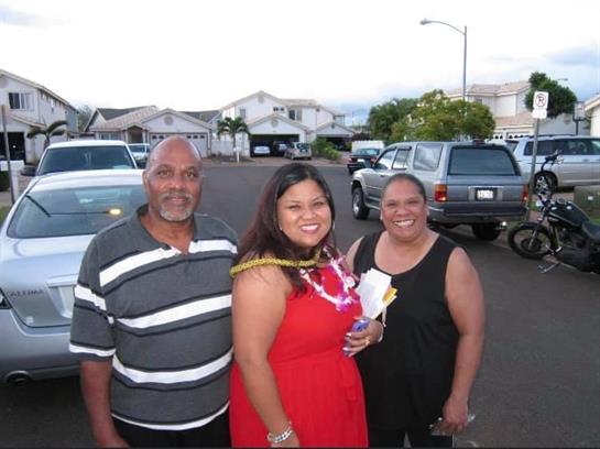 A joyful outdoor gathering with friends and family in a suburban neighborhood at dusk.