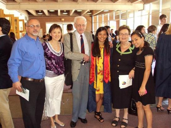 Friends and family come together at a graduation ceremony to celebrate academic achievements.