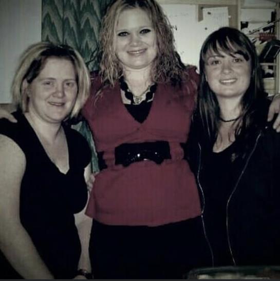 Friends gather for a delightful time, sharing laughter and joy in a cozy indoor environment.