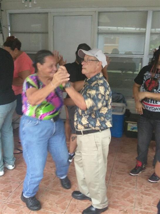 Seniors join together in joyful dancing at a community event, celebrating life and connection.
