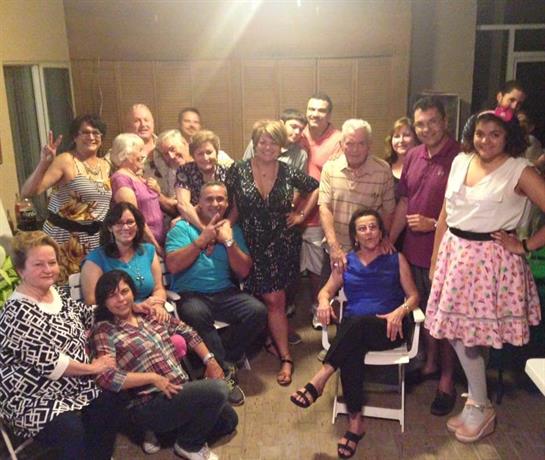 Friends and family gather in a lively atmosphere, sharing laughter and good times together.