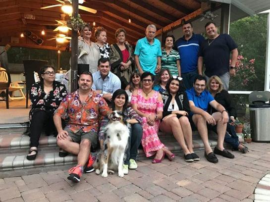 People are celebrating together outdoors in a cozy setting, enjoying each other's company.