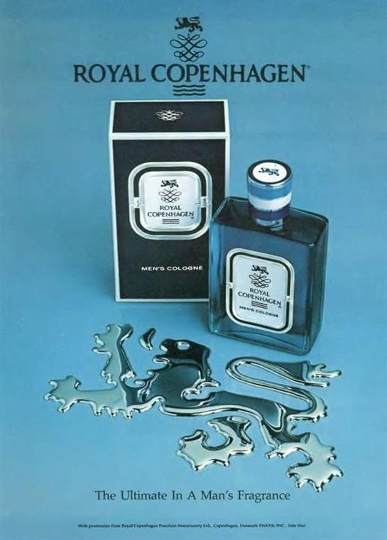 Royal Copenhagen perfume displayed with its box and silver sculptures on a blue background.