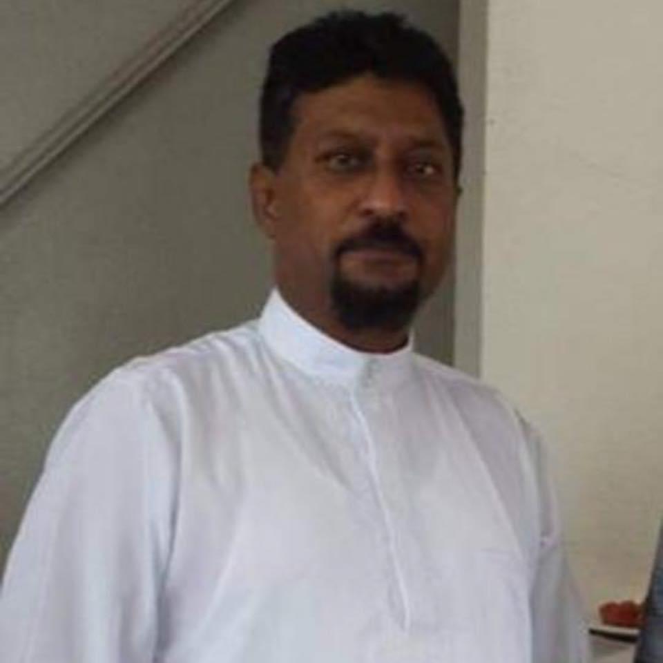 A man in a white shirt