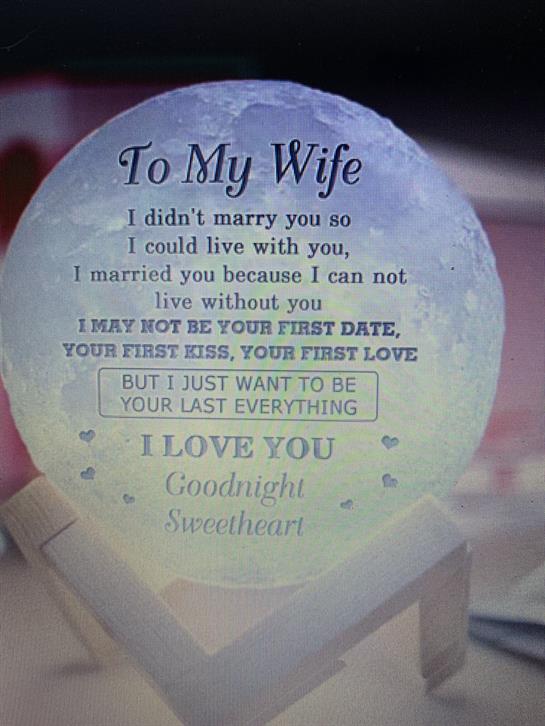 A heartfelt message for a wife is displayed beautifully in a decorative keepsake near soft lighting.