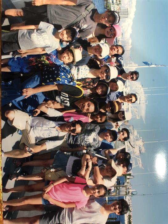 A lively crowd of kids and adults gathered at the marina for a fun community event.