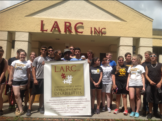 Volunteers gather at LARC Inc in Florida to support people with developmental disabilities.
