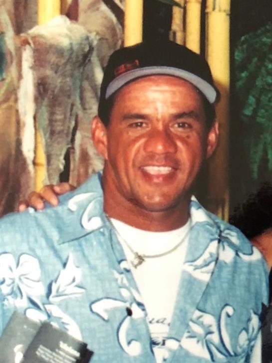 Friends enjoy a cheerful moment together at a vibrant location under the sun.