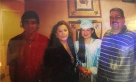 Family members gather to celebrate a graduation, showcasing pride and joy on this special occasion.