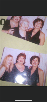 Three friends pose joyfully together, dressed elegantly for a special occasion at night.