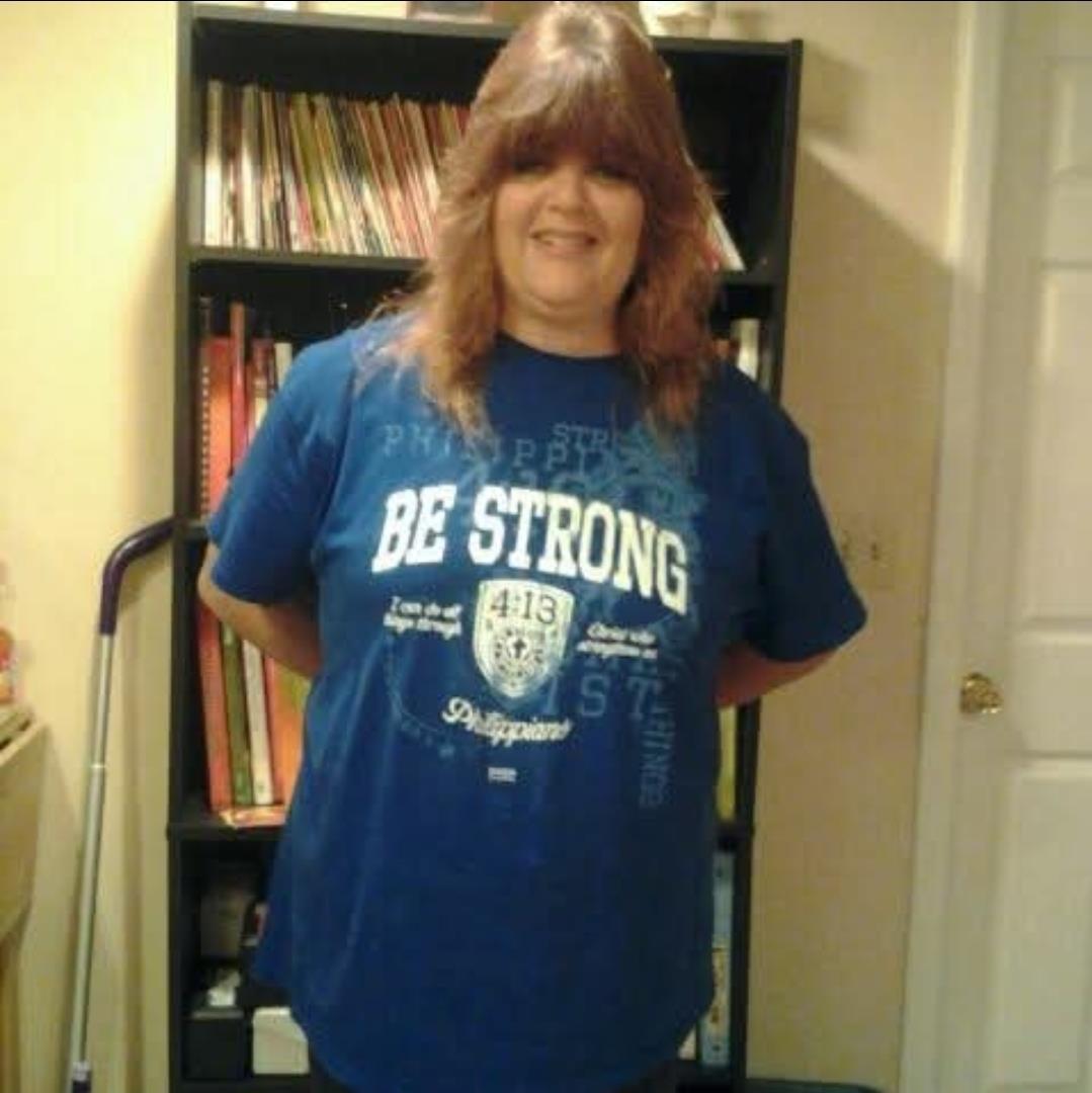 A woman standing in front of a bookcase