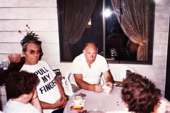 A cozy night with friends gathered around a table, enjoying each other's company.