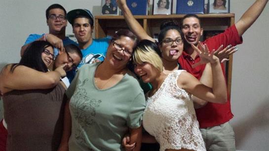 A group of friends enjoys a lively evening together, sharing laughter and good spirits at home.