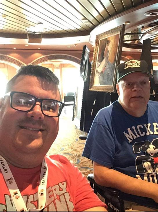 Friends share smiles and laughter in a cozy cruise ship lounge while relaxing.