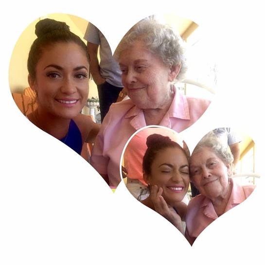 A young woman and her grandmother share a warm smile at the café, enjoying their time together.