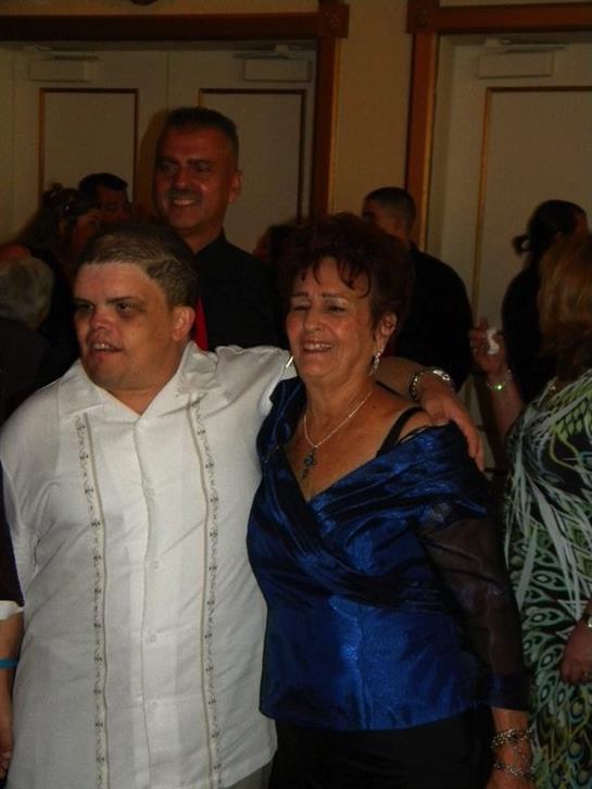 Guests enjoy an energetic celebration together, sharing smiles and laughter during the event.