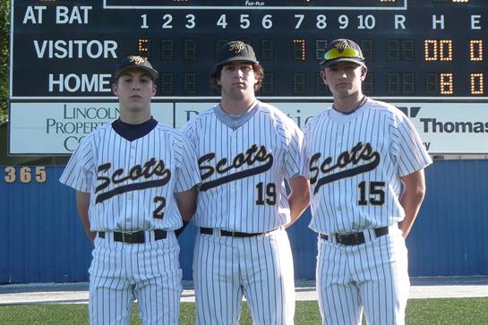 Three baseball players stand proudly in their striped uniforms at a stadium, ready for a game.
