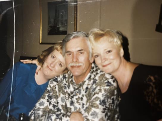 Three friends share laughter and camaraderie, creating lasting memories during a pleasant evening.