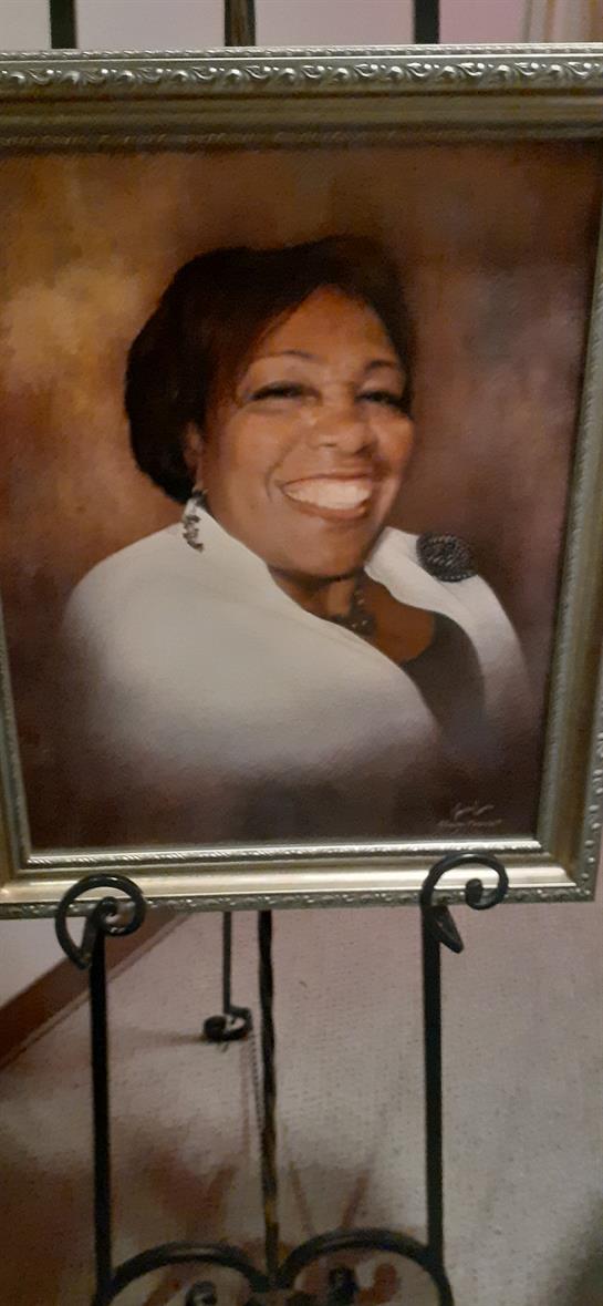 A joyful woman is portrayed in a detailed painting showcased at an art exhibition.