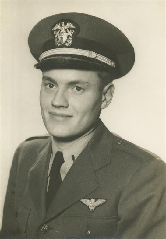 A young military officer poses in uniform, showing pride and confidence during the 1940s.