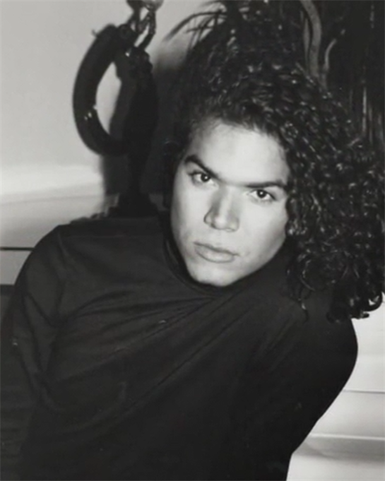 A fashion model confidently showcases unique attire, embodying style and attitude.