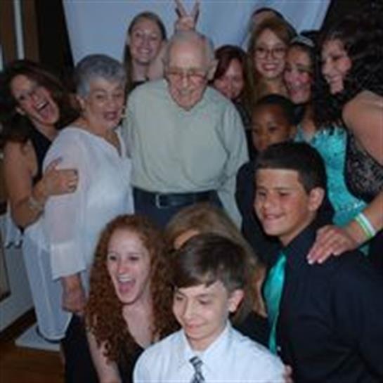 A family poses together, showing joy and unity during their celebration.