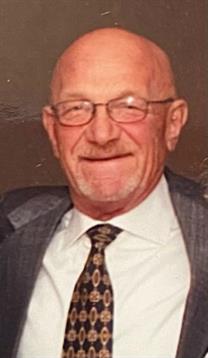 A joyful elderly man dressed in a suit and tie enjoys a cheerful moment at a gathering.