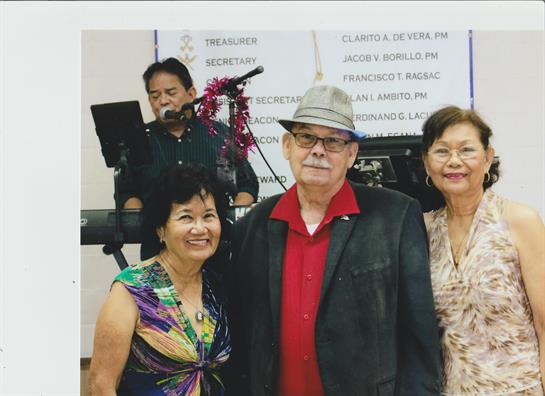 Friends enjoy each other's company at a vibrant event filled with music, smiles, and joy.