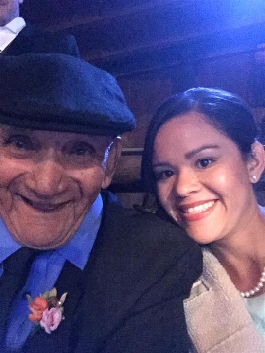 Two people share a joyful moment at a festive gathering, reflecting their happiness.