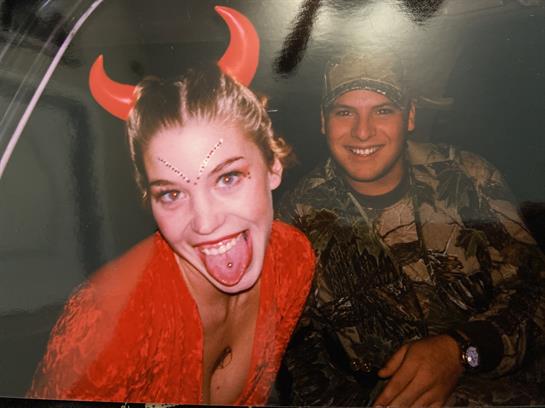 Friends celebrate together in playful costumes at a fun and festive gathering.