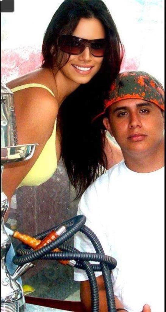 Friends relax at the beach, enjoying sun and water games while laughing and socializing together.