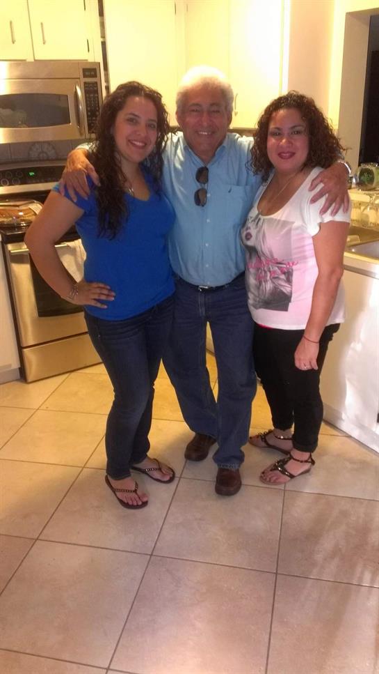 Friends gather in a well-lit kitchen, sharing laughter and creating memories together.