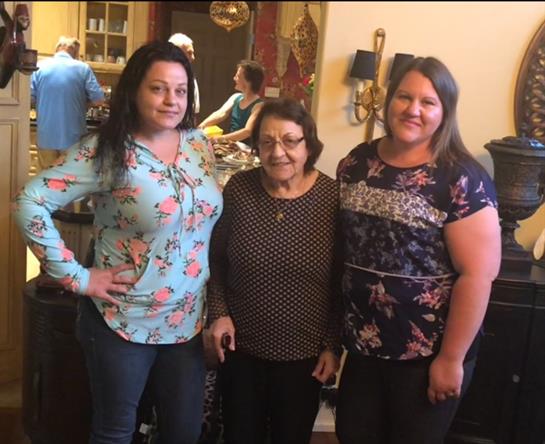 Friends and family gather in a warm living room to enjoy each other’s company in the afternoon.