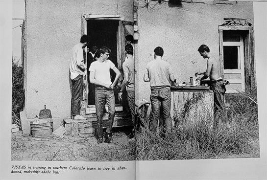 Men gather around a cabin in Colorado, preparing food and enjoying time together outdoors.