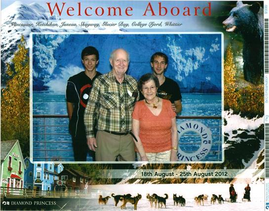 Four individuals pose together, smiling, during a Caribbean cruise in August 2012.