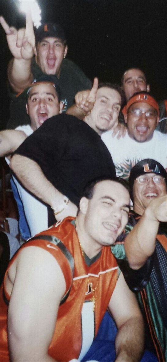 Friends express excitement during a sports gathering, showcasing team spirit and camaraderie.