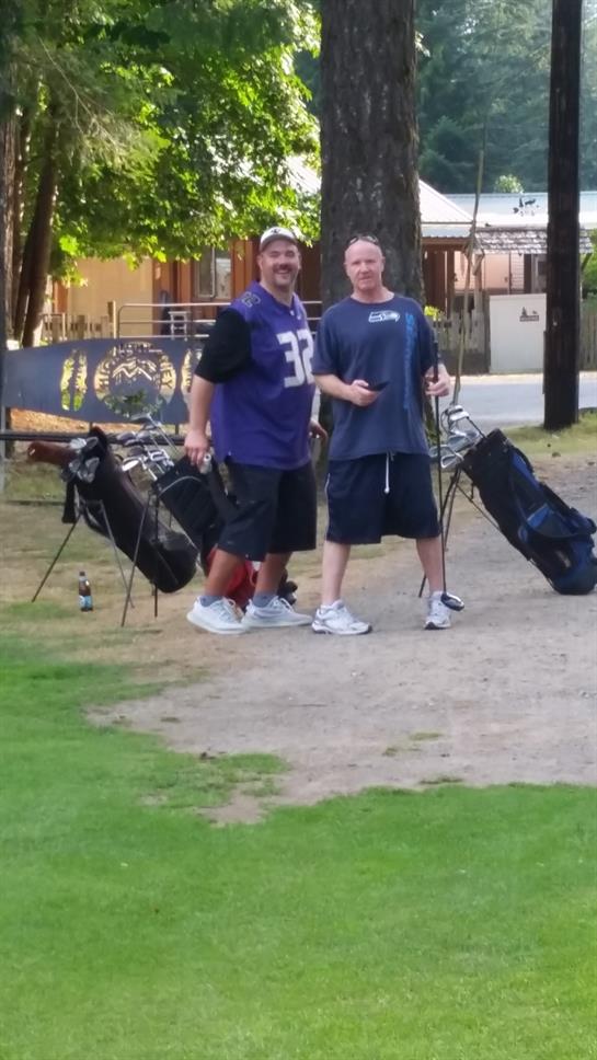 Friends gather at the park with golf bags, ready to enjoy a game on a bright day outside.